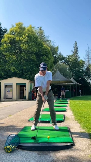 Driver swing, face on, slow motion.